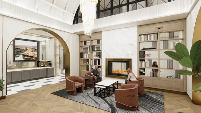 Community lounge area with fireplace, bookshelves, and seating.