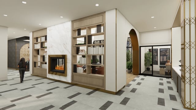 Lobby with a fireplace and seating area.