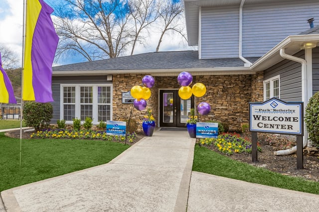 The Park at Netherley Welcome Center entrance with balloons and signage.