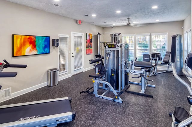Fitness center with cardio and weight machines.