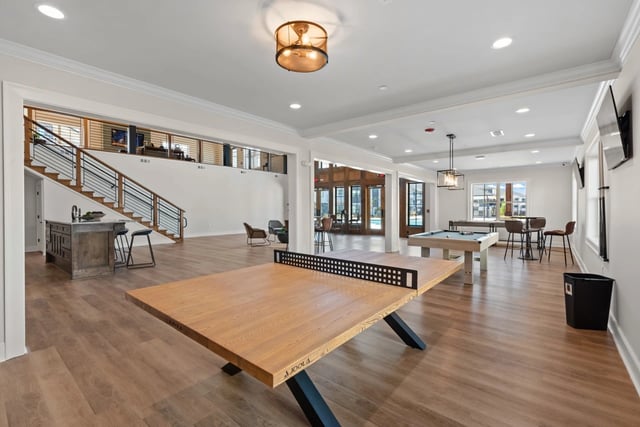 Community game room with ping pong table and pool table.