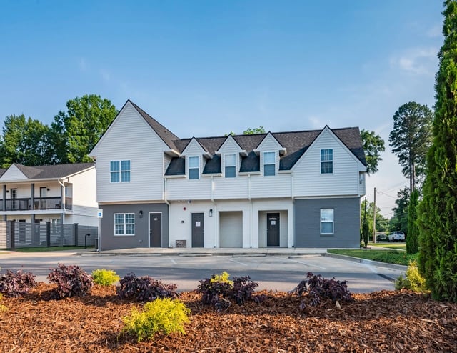 Exterior view of the property buildings and landscaping.