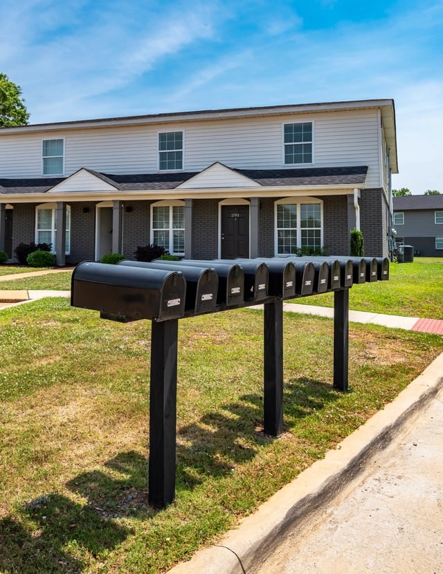 Row of mailboxes in front of apartment buildings