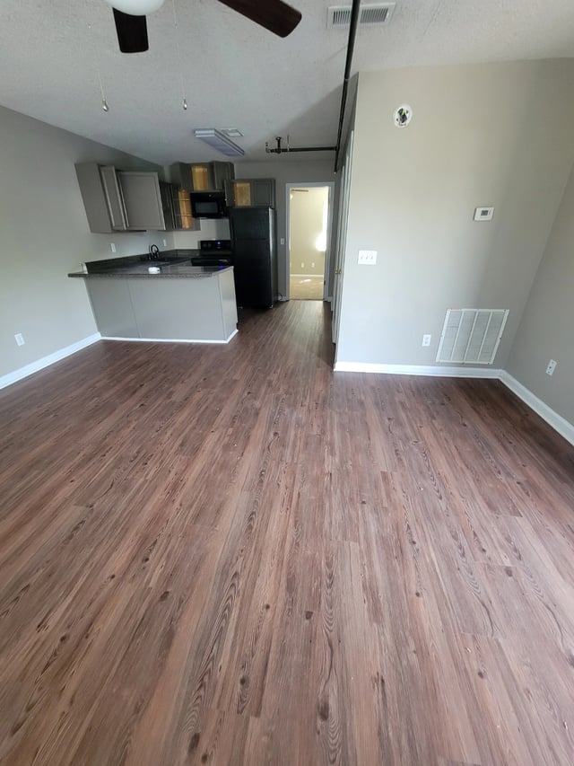 Interior of an apartment kitchen and living room.
