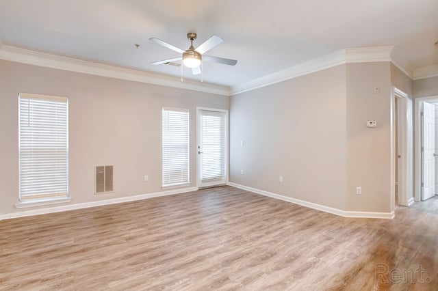Spacious living room with light beige walls, wood-look flooring, and a ceiling fan.