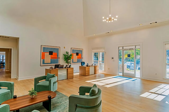 Reception area with modern seating and front desks.