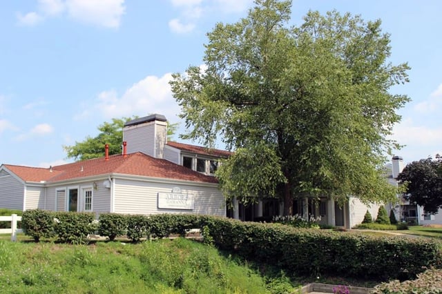Exterior building with landscaping and signage.