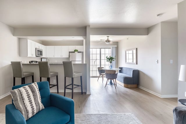 Open concept living area with a kitchen island and bar seating.