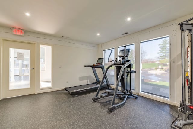Fitness center with treadmills and elliptical machines.