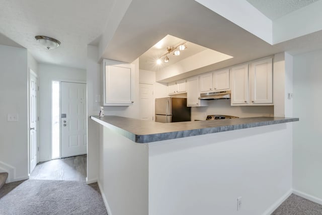 Kitchen and entryway of apartment
