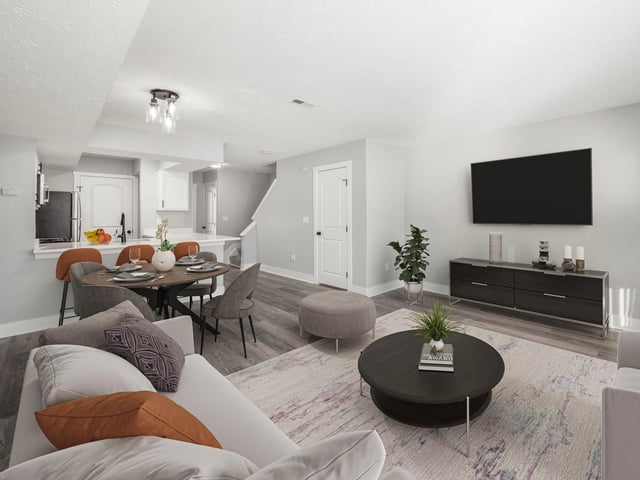 Open concept living and dining area with a kitchen view.