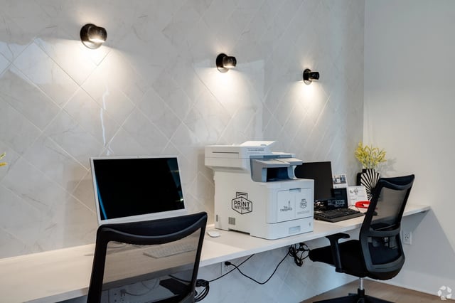 Business center with printer and computers.