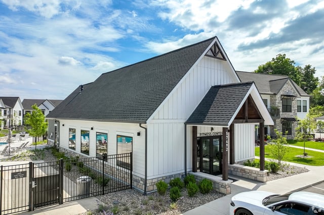 Fitness Center and swimming pool at modern apartment complex.