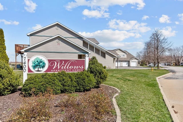 The Willows Apartment Homes monument sign with address 7400