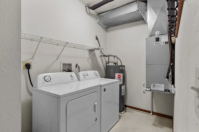 In-unit washer and dryer with water heater and HVAC unit.