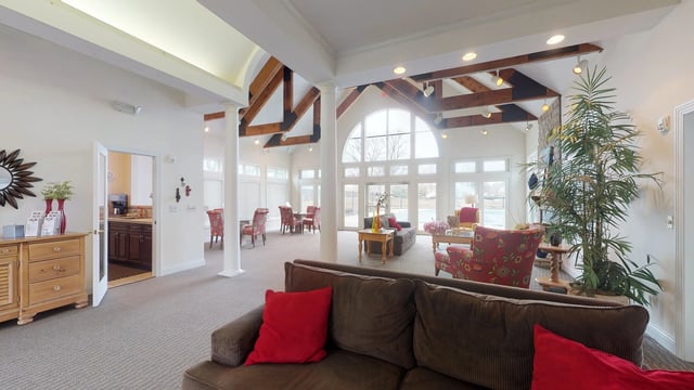 Community lounge area with seating and large windows.