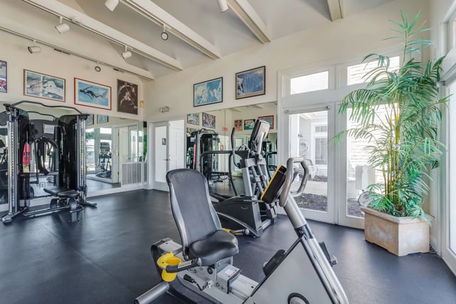 Fitness center with cardio machines and weight equipment.