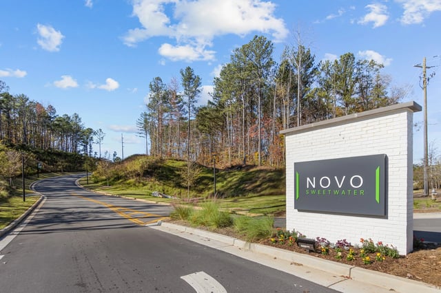 Novo Sweetwater community entrance sign and road.