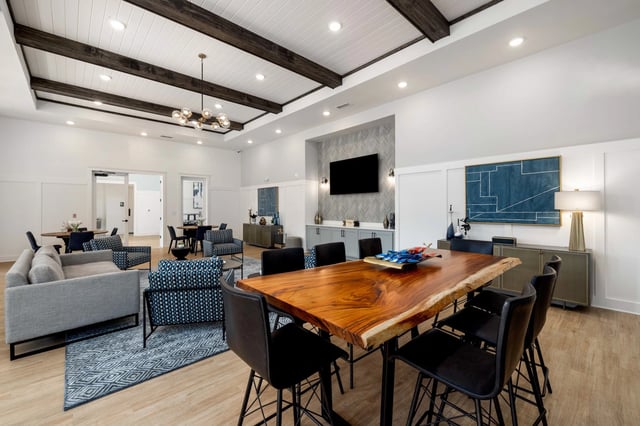 Community lounge area with a live edge dining table and seating.
