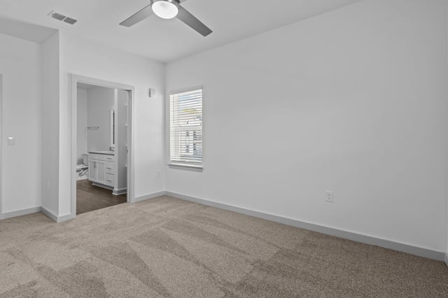 Bedroom with ceiling fan and window, view of bathroom