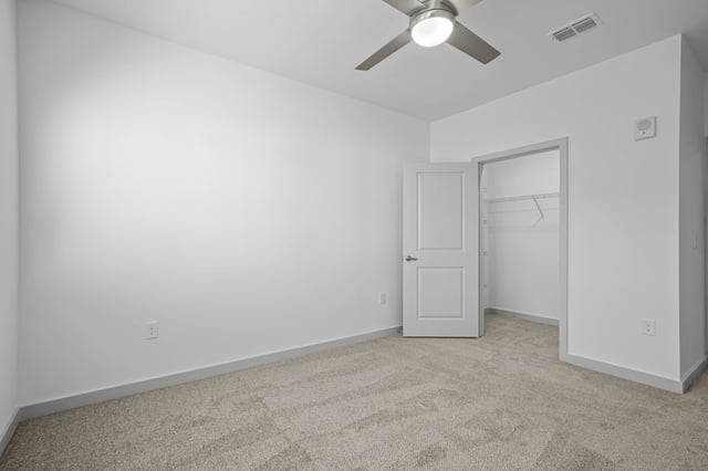 Bedroom with a ceiling fan and an open closet.