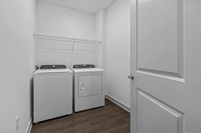 In-unit washer and dryer with storage shelf.