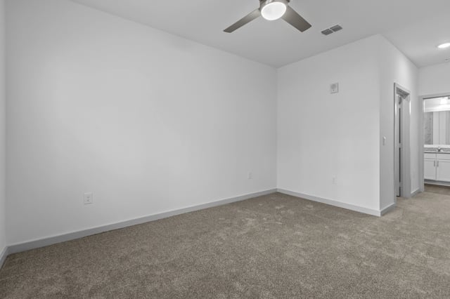 Bedroom with carpet and ceiling fan.