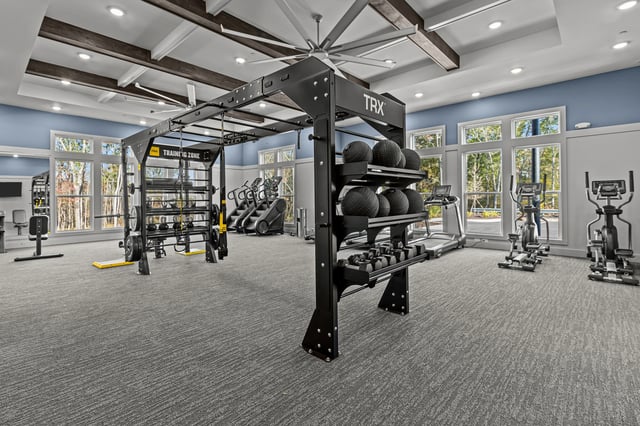 Gym with weight training equipment, treadmills, ellipticals, and stair climbers.