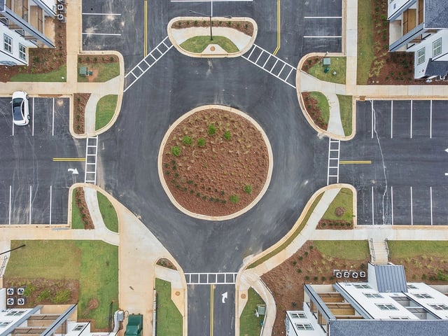 Aerial view of a new apartment complex's interior road system and parking lots.