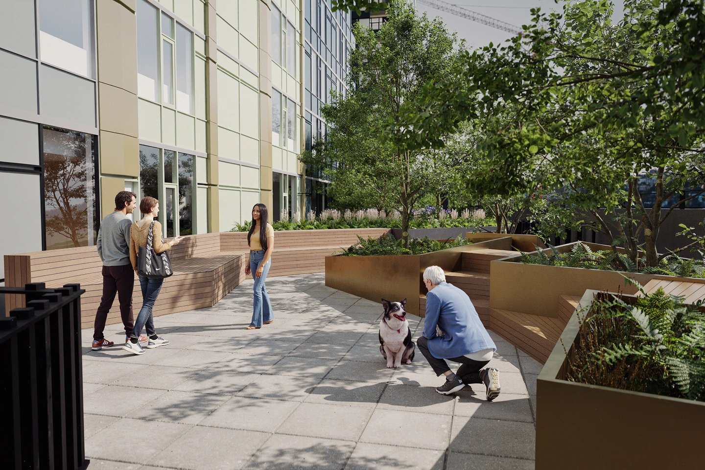 People chat in an outdoor apartment courtyard with benches and trees.