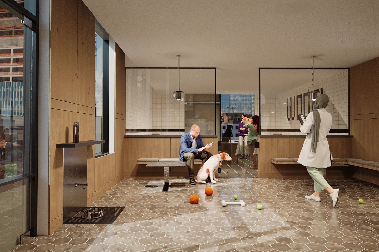 Indoor apartment lobby with a man seated with a dog and a person walking in the background.
